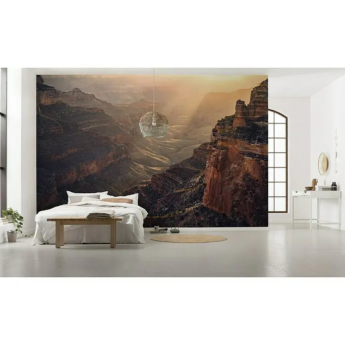 Komar Stefan Hefele Edition 2 Fototapete Grand Wonder - 9 -tlg., B x H: 450 x 280 cm, Vlies - Ein Schlafzimmer mit einer Wandtapete, die eine atemberaubende Landschaft des Grand Canyon zeigt, die dem Raum eine natürliche Note verleiht.