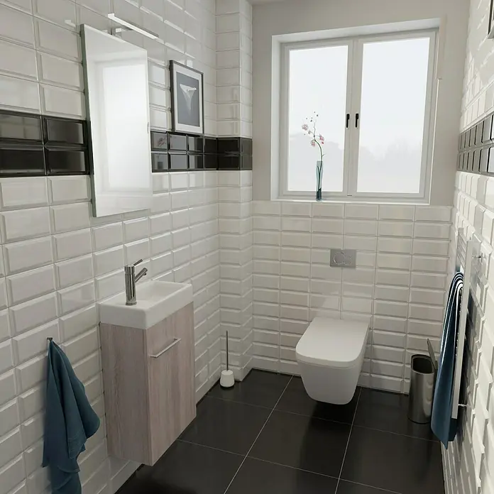 Camargue Espacio Waschtischunterschrank - 40 x 22 x 60 cm, Faro - Das Badezimmer präsentiert eine stilvolle Toilette, einen Waschtisch und helle Wandfliesen, die ein modernes und sauberes Ambiente schaffen.