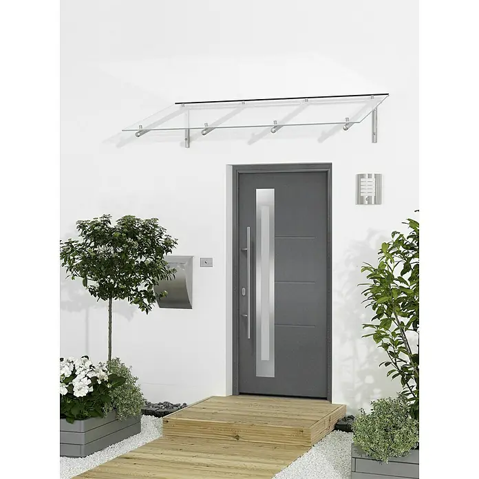 Hörmann EcoStar Haustür ISOPRO IP 780S - 110 x 210 cm, DIN Anschlag: Links, CH 703 Anthrazit Metallic - Ein elegantes Vordach aus Glas mit einer modernen Haustür in Grau, umgeben von Pflanzen. Das Glasvordach bietet Schutz vor Wettereinflüssen.