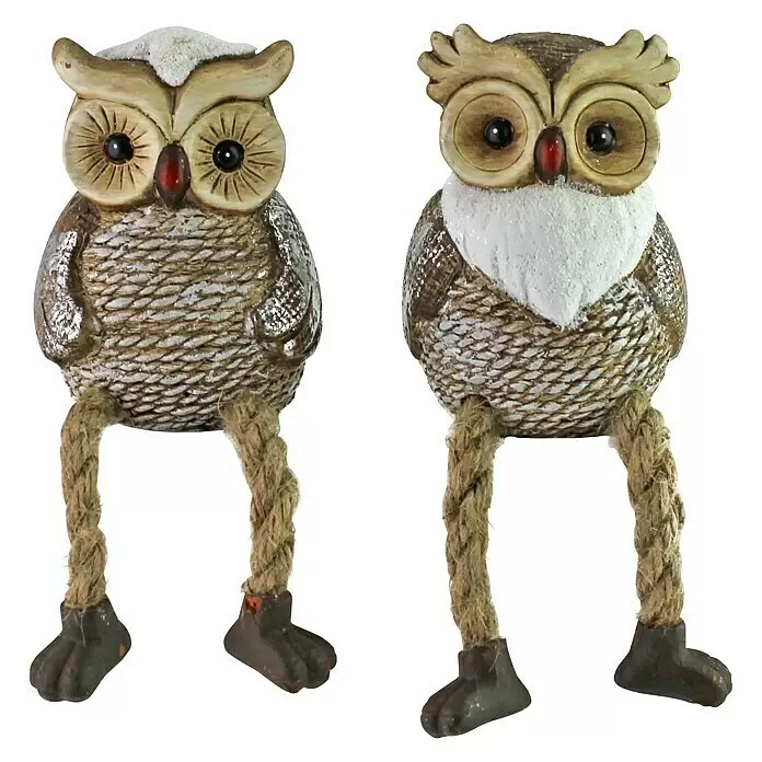 Dekofigur Eulen - Keramik, Eule - Zwei dekorative Eulenfiguren mit texturiertem Körper, weißen Glitzerakzenten und baumelnden Seilbeinen mit dunklen Füßen.