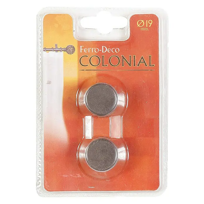 Tapones terminales Colonial - Óxido, 2 ud. - Primer plano de un envase de terminales de barra de cortina Ferro-Déco Colonial con un diámetro de 19 mm, presentado en un blíster transparente.