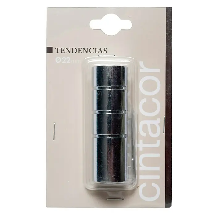Tapa final Cilindro II Tendencias - Cromo, 1 ud. - Un paquete de cuatro anillas para cortinas de 22 mm en acabado cromado, empaquetadas en un blíster de plástico transparente sobre una tarjeta beige con detalles oscuros.