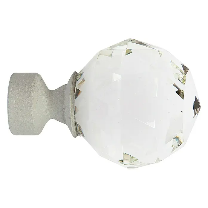 Tapa final Diamante - Blanco, 1 ud. - Primer plano de un extremo de barra de cortina de cristal con base gris, que añade elegancia y estilo a las ventanas.