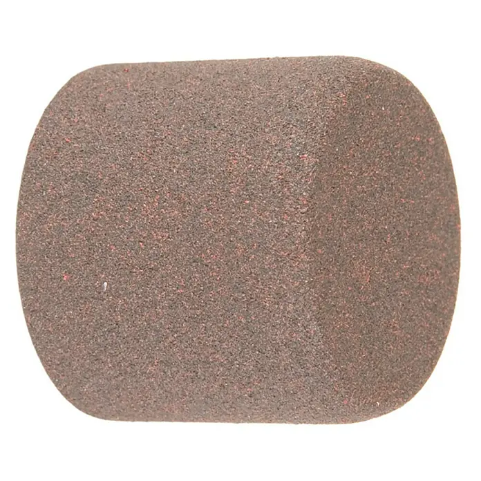 Tapones terminales Colonial - Óxido, 2 ud. - Primer plano de una piedra de afilar marrón rojiza, utilizada para afilar herramientas.