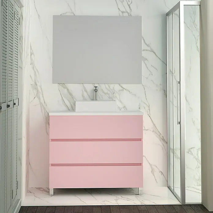Artysan Mueble bajo de lavabo Colours - An x Pr x Al: 90 x 44,6 x 83 cm, Rosa - La imagen muestra un moderno tocador con cajones rosas, un lavabo sobre encimera blanco y un gran espejo en un baño elegante.