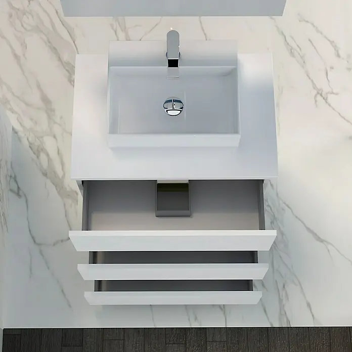 Artysan Mueble bajo de lavabo Colours Slim - L x An x Al: 39 x 50 x 83 cm, Blanco seda - Toma detallada de un tocador de baño blanco moderno con lavabo y cajones abiertos contra un fondo de mármol.