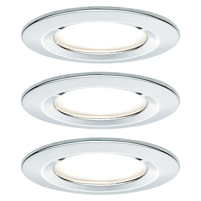 Paulmann LED-Einbauleuchte Nova feststehend - 6,5 W, Chrom, Warmweiß - Nahaufnahme von drei LED-Einbaustrahlern mit Chromfassung und warmweißem Licht auf schwarzem Hintergrund.