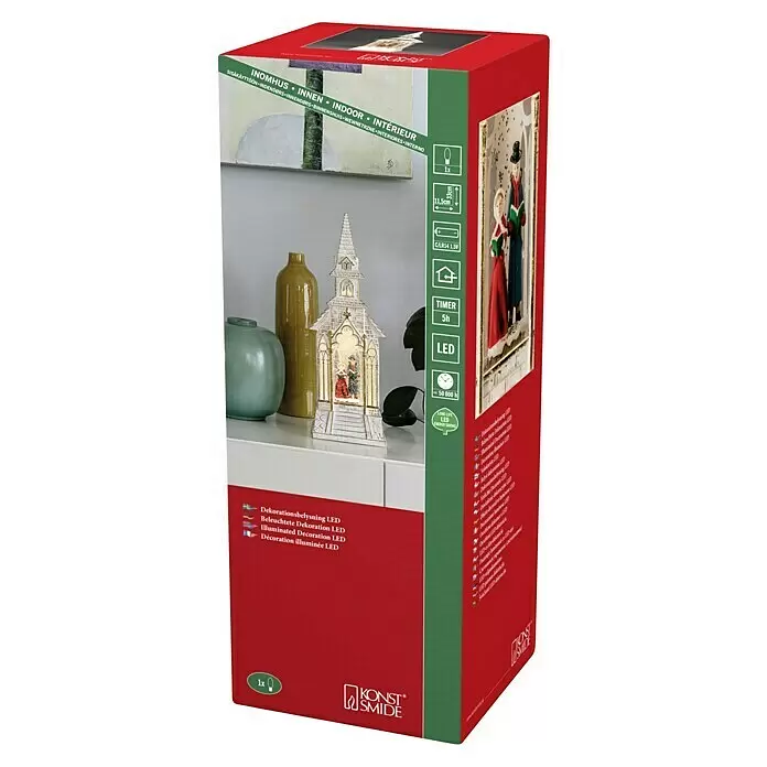 Konstsmide LED-Schneelaterne - Innen, Rot, 9,5 x 9,5 x 20 cm, Laterne, Batteriebetrieben - Produktverpackung für eine weiße, LED-beleuchtete Kirchendekoration mit Figuren.