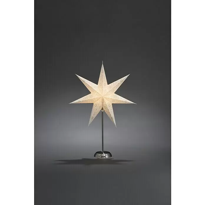 Konstsmide LED-Stern - Weiß, IP20, Netzbetrieben - Eine beleuchtete, cremefarbene Sternlampe aus Papier mit feinen Musterausschnitten auf einem silbernen Metallständer.