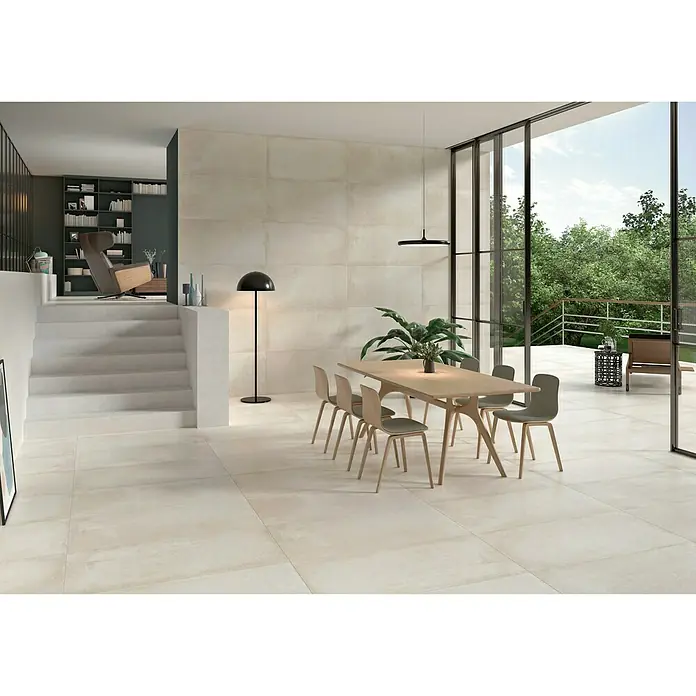 BHS Showroom Pavimento porcelánico Stoneage Soft - 120 x 60 cm, Arena, Resistencia a la abrasión - PEI: 4 - Tránsito intenso, Rectificado - Interior elegante con baldosas de gran formato en tonos neutros, creando un ambiente moderno y espacioso.