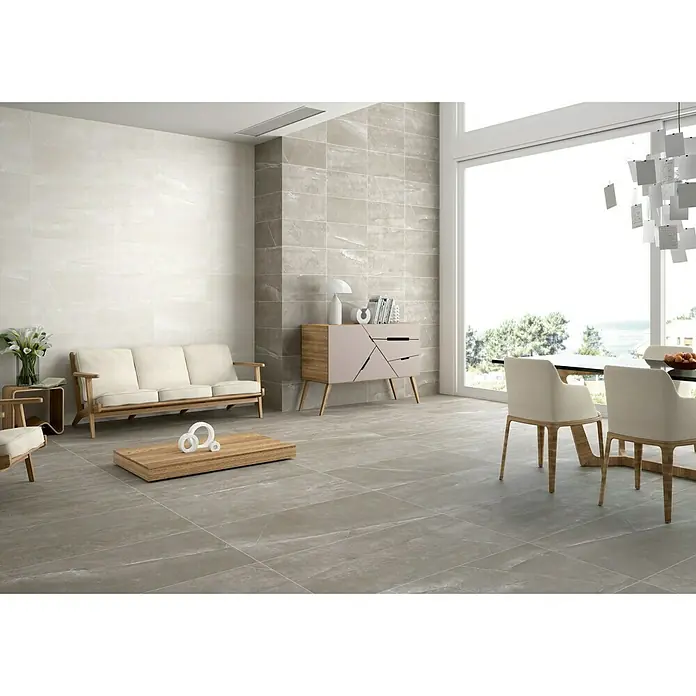 BHS Showroom Pavimento porcelánico Talo - 120 x 60 cm, Blanco, Rectificado - Elegantes baldosas de suelo grises en un espacio habitable luminoso y moderno. Las baldosas le dan a la habitación un aspecto elegante y de alta calidad.