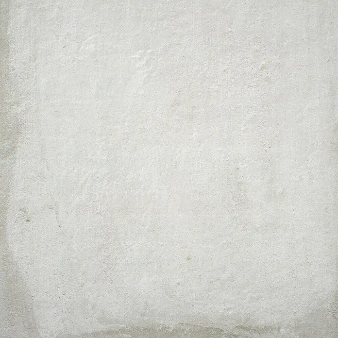 BHS Showroom Pavimento porcelánico Stoneage Soft - 60 x 60 cm, Concreto, Rectificado - Un primer plano revela la textura fina de una superficie gris claro y texturizada, que muestra una elegancia sutil.