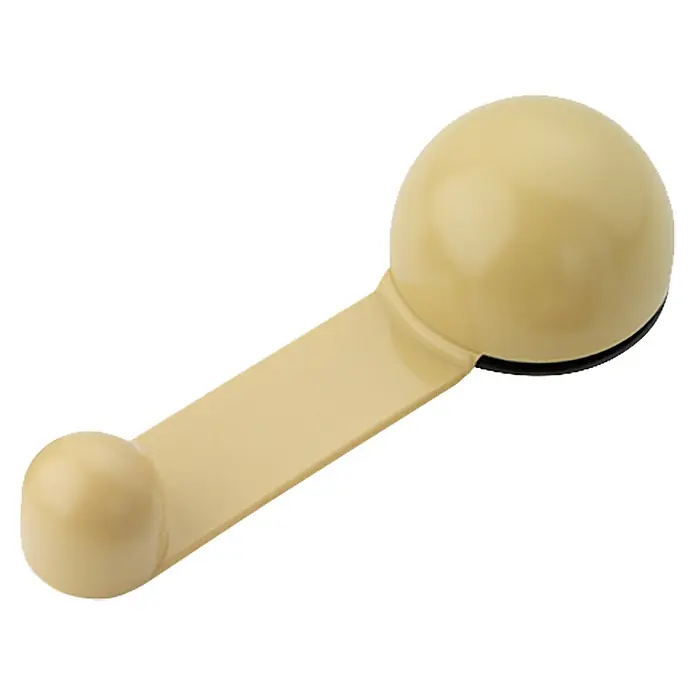 Inofix Tope de puerta retenedor 2035 - Plástico, Beige, 4 ud. - Primer plano de una manija de ventana, con un color beige y un diseño sencillo, sobre un fondo blanco.