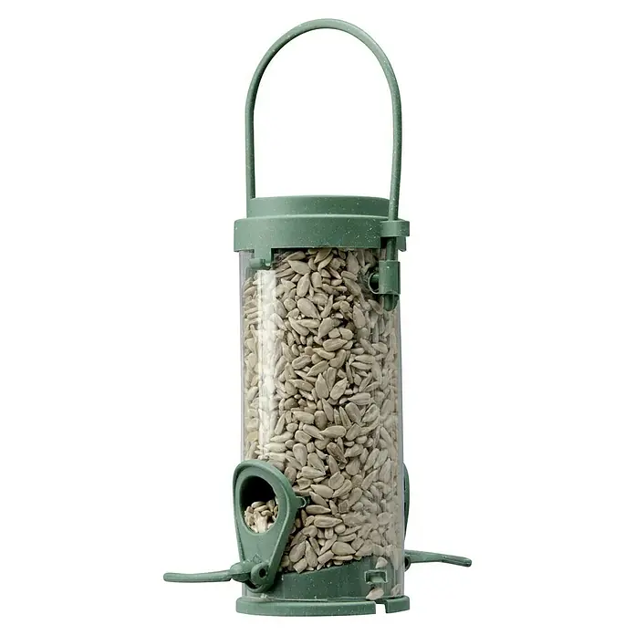 CocoBird Wildvogelfutter - 180 g - Eine grüne, zylindrische Vogeltränke gefüllt mit Sonnenblumenkernen, mit einem Griff oben und Futterstellen an der Seite.