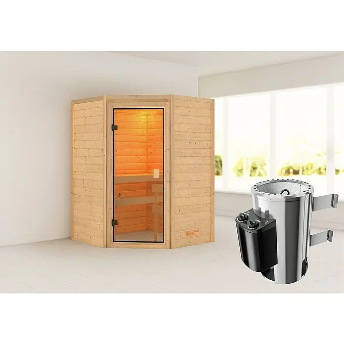 Karibu Massivholzsauna Antonia - Elektroofen, Steuerung Ofen: Integriert, L x B x H: 145 x 145 x 187 cm, Ohne Dachkranz - Eine Sauna mit Holzverkleidung und Glastür, daneben ein Saunaofen aus Metall.