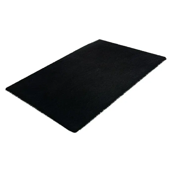 Badteppich Happy - 60 x 40 cm, Naturmaterialien, Schwarz - Ein rechteckiger, schwarzer Teppich mit hohem Flor liegt auf einem weißen Hintergrund. Der Teppich hat eine weiche, flauschige Textur.