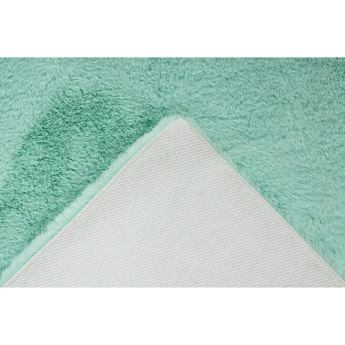 Badteppich Happy - 50 x 90 cm, Mint, 100% Polyester - Detailaufnahme eines türkisfarbenen Teppichs mit weicher Oberfläche und rutschfester Unterseite für Komfort und Sicherheit.