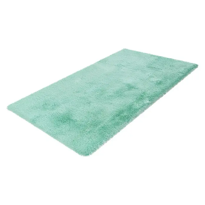 Badteppich Happy - 50 x 90 cm, Mint, 100% Polyester - Ein weicher, rechteckiger Teppich in einem hellen Türkiston liegt auf einem weißen Hintergrund. Der Teppich hat eine flauschige Textur.