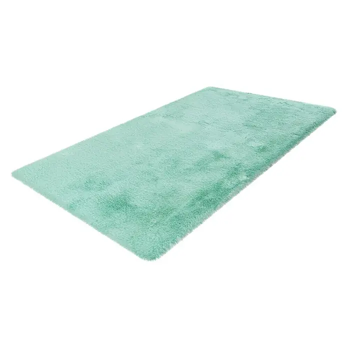 Badteppich Happy - 67 x 110 cm, Mint, 100% Polyester - Nahaufnahme eines rechteckigen, mintgrünen Hochflorteppichs, der auf einem weißen Hintergrund liegt und dessen weiche Textur betont.