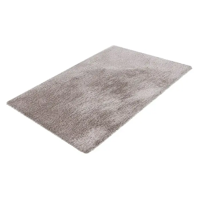 Badteppich Happy - 40 x 60 cm, Silber, 100% Polyester - Das Bild zeigt einen grauen, rechteckigen Hochflorteppich mit weichen Fasern auf einem weißen Hintergrund. Der Teppich hat eine ungleichmäßige Textur.