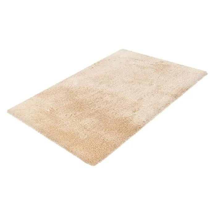 Badteppich Happy - 40 x 60 cm, Beige, 100% Polyester - Beigefarbener, rechteckiger Teppich mit hochflorigem Flor, der auf einem weißen Untergrund liegt. Der Teppich verleiht Wärme und Komfort.