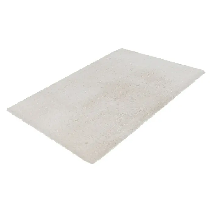 Badteppich Happy - 40 x 60 cm, Weiß, 100% Polyester - Nahaufnahme eines rechteckigen, hochflorigen, weißen Teppichs, der eine weiche und einladende Textur aufweist. Perfekt, um jedem Raum Wärme zu verleihen.