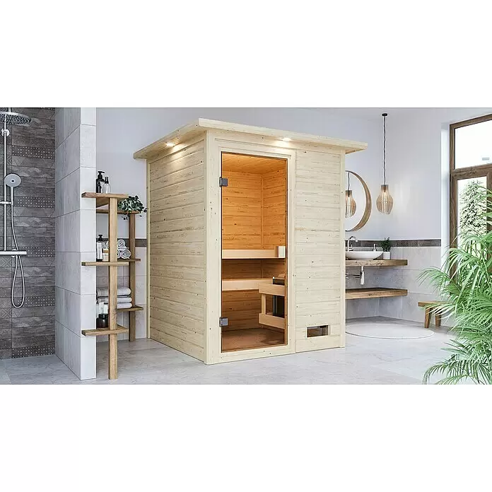 Karibu Massivholzsauna Sandra - L x B x H: 159 x 173 x 191 cm, Mit Dachkranz und Beleuchtung, Inklusive Ofenschutzgitter - Stimmungsaufnahme