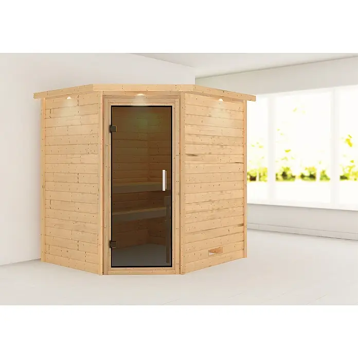 Karibu Massivholzsauna Mia - L x B x H: 184 x 224 x 202 cm, Materialspezifizierung Tür: Ganzglas Graphit, Inklusive Ofenschutzgitter, Mit Dachkranz und Beleuchtung - Ein Ecksauna-Bausatz mit Glastür und Holzverkleidung, ideal für Entspannung und Wellness zu Hause.