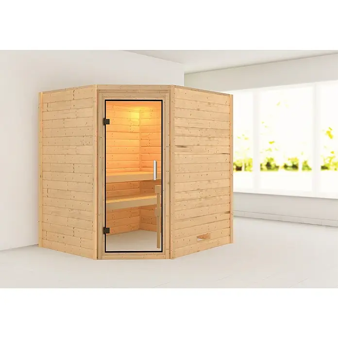 Karibu Massivholzsauna Mia - L x B x H: 170 x 196 x 198 cm, Materialspezifizierung Tür: Ganzglas Klar, Inklusive Ofenschutzgitter, Ohne Dachkranz - Innenaufnahme einer Holzsauna mit Glastür und Bänken, die in einem hellen Raum mit Fenstern steht.