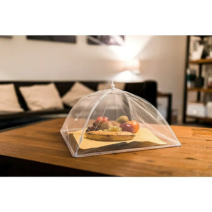 Schellenberg Rollo de fibra de vidrio para alimentos - L x An x Al: 250 x 350 x 350 mm, Poliéster - Una cubierta de alimentos transparente y plegable protege frutas y pan sobre una mesa de madera de los insectos, manteniéndolos frescos.