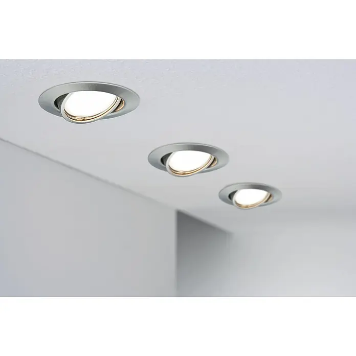 Paulmann Einbauleuchten-Set Base - 10 W, Eisen gebürstet, 10 Stk. - Drei silberne, runde Deckeneinbaustrahler mit warmweißem Licht beleuchten einen Raum mit minimalistischem Design und sorgen für eine angenehme Atmosphäre.