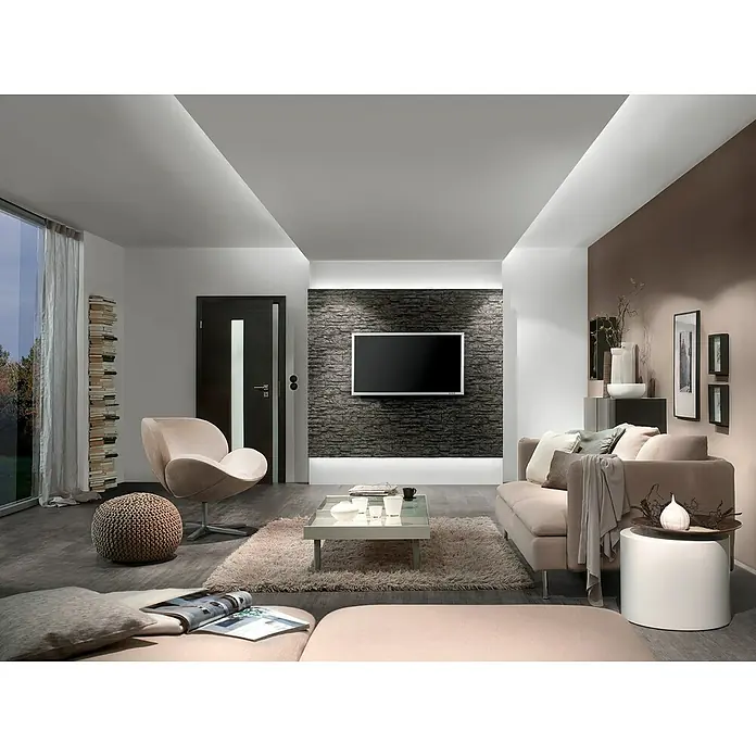Paulmann MaxLED Stromeinspeisung Power Supply 40VA DC - B x H: 52 x 24 mm, Weiß - Ein modernes Wohnzimmer mit einem stilvollen Sofa, einem Couchtisch und einem Fernseher an einer dekorativen Wand. Elegantes Design mit angenehmer Beleuchtung.
