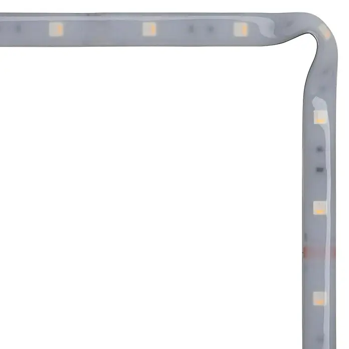 Paulmann MaxLED 250 LED-Band RGBW beschichtet IP44 - Länge: 1 m, Lichtfarbe: RGBW, 7 W, 270 lm, Anwendungsbereich: Außen - Nahaufnahme einer LED-Lichterkette in einem weißen Gehäuse, die in einem rechten Winkel gebogen ist.