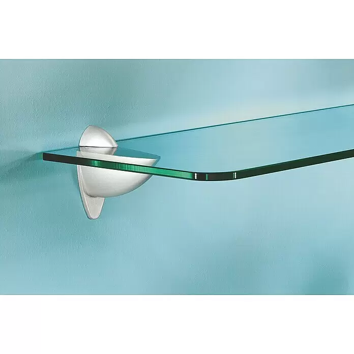 Dolle Set de soportes de pared para estantes Metallclip - Carga soportada: 25 kg, Específico para: Baldas de 6 - 25 mm, Plateado, 2 ud. - Estante curvo de cristal transparente con bordes verdes, soportado por un elegante soporte plateado en una pared azul texturizada.
