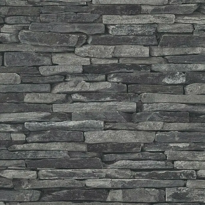 A.S. Création Elements Vliestapete Bruchsteinmauer - Grau/Schwarz, Steinoptik, 10,05 x 0,53 m - Nahaufnahme einer grauen Steinwand mit verschiedenen Texturen und Farbtönen, die eine rustikale und natürliche Optik verleihen.