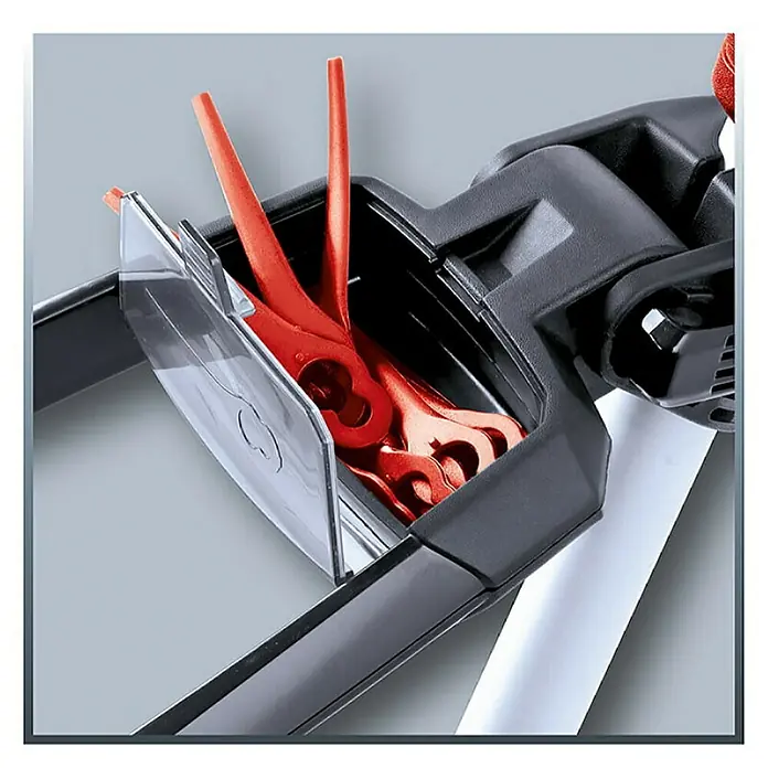 Einhell PXC 18V Recortabordes de batería GE-CT 18 Li-Solo - 18 V, Iones de litio, Sin batería - Primer plano de un cortacésped con cuchillas de repuesto rojas en un compartimento transparente para facilitar el acceso y el cambio rápido.
