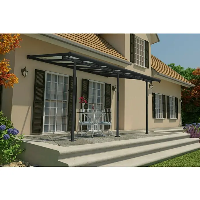 Palram – Canopia Marquesina adosada Sierra - An x Pr: 434 x 299 cm, Antracita, Policarbonato, Gris - Imagen de una cubierta de patio con marco antracita, que da sombra a una zona de comedor al aire libre y la protege de los elementos.