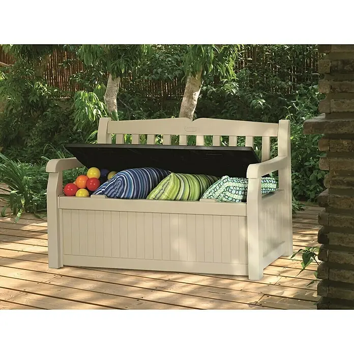 Keter Banco de jardín Eden - L x An x Al: 60 x 140 x 84 cm, Plástico, Beige/Marrón espresso - Banco de exterior con espacio para cojines y juguetes. El banco está sobre una plataforma de madera y está parcialmente abierto.