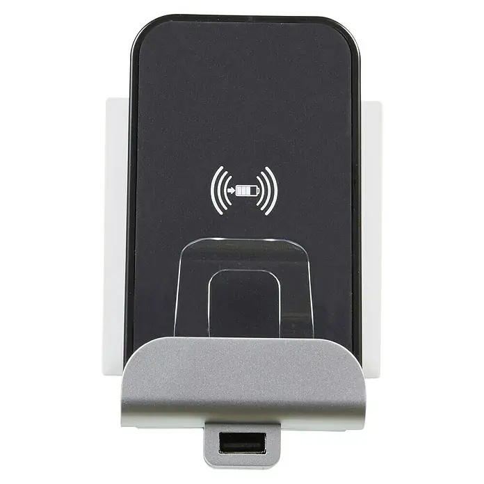 Legrand Niloé Step Cargador por inducción + USB - Aluminio - Primer plano de una estación de carga inalámbrica con carcasa negra y puerto USB para la carga de dispositivos.