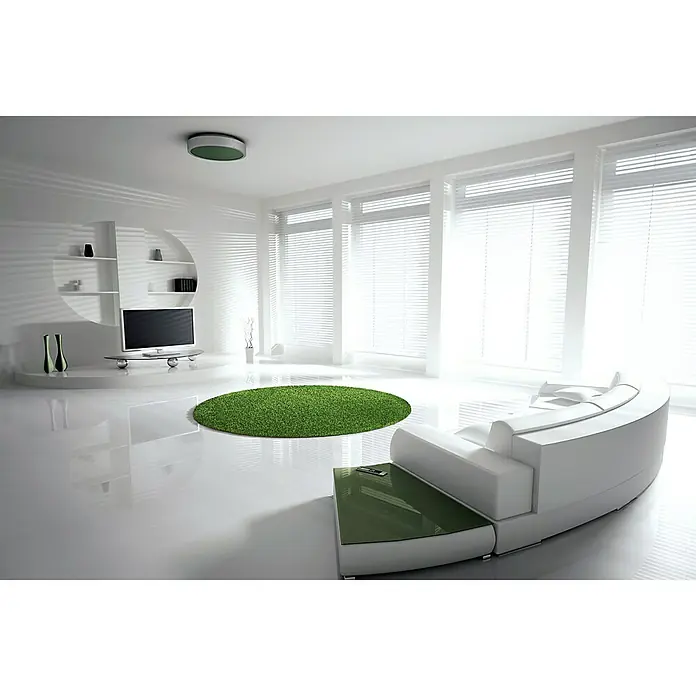 Classis Carpets Infinity Grass Rasenteppich World of Colors - 200 x 133 cm, Ultimate Green - Ein grüner, runder Kunstrasenteppich in einem modernen Wohnzimmer. Perfekt als Farbtupfer und Blickfang.