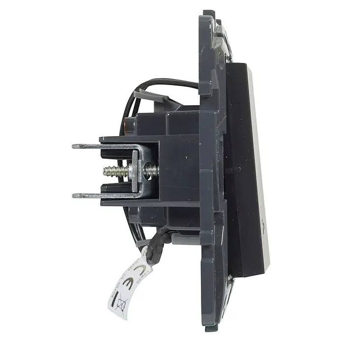 Legrand Niloé Step Conmutador - Antracita, Mate, Montaje en la pared - Imagen de un interruptor de luz gris desde una vista lateral, mostrando los detalles de construcción y el soporte de montaje del producto.