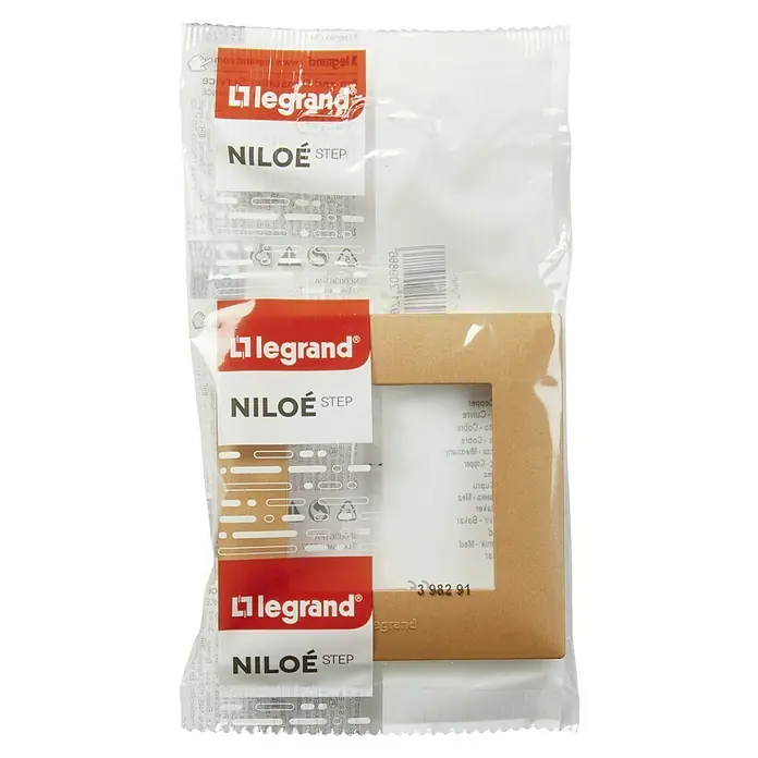 Legrand Niloé Step Marco - Cobre, Modelo de mecanismos: x 1, Plástico, Instalar - Placa de cubierta Legrand Niloe Step en aspecto dorado, empaquetada en envoltorio de plástico transparente.