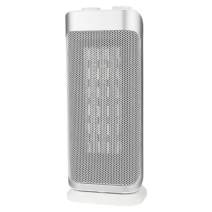 Voltomat HEATING Calefactor cerámico Torre - 2.000 W, Plateado, 20,5 x 16,2 x 44,5 cm - Primer plano de un calefactor con carcasa metálica blanca perforada y marco plateado sobre una base blanca.