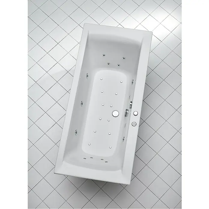 Ottofond Whirlpool Palermo - 170 x 75 cm, Sanitäracryl, Weiß, Inklusive Ab- und Überlaufgarnitur - Blick von oben auf eine rechteckige, weiße Whirlpool-Badewanne mit eingebauten Düsen und Armaturen, eingebettet in ein gefliestes Badezimmer.