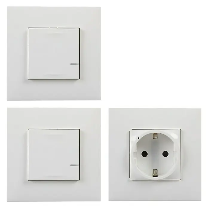 Legrand Valena Next with Netatmo Enchufe Extensión pack - Blanco, Plástico, Montaje en la pared - Interruptores de luz blancos y un enchufe en una superficie negra, mostrando el diseño y la funcionalidad.