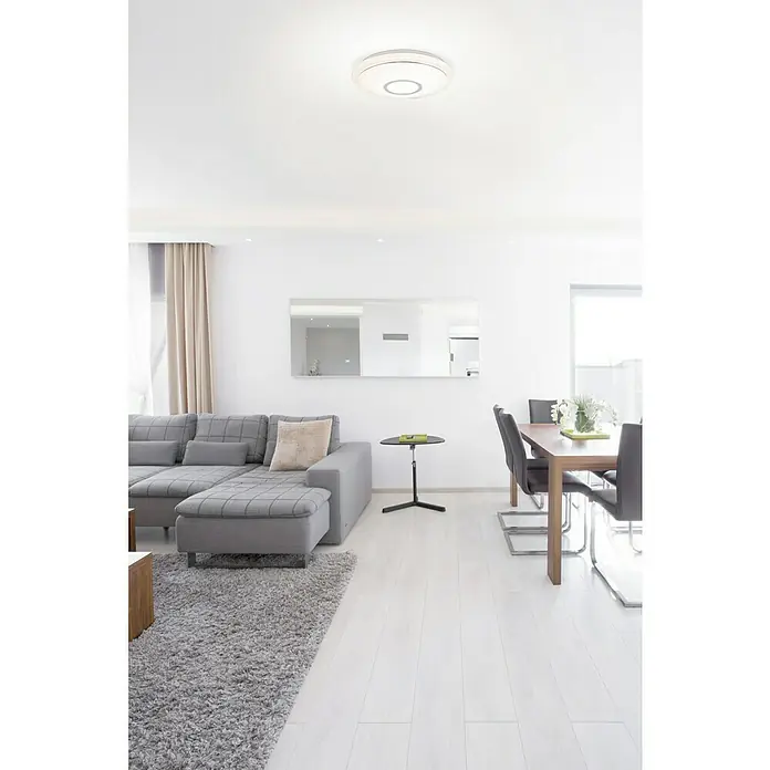 Lavida Plafón LED redondo Solesino - 16 W, Ø x Al: 400 mm x 8 cm, Blanco - Un espacio habitable moderno con una lámpara de techo elegante que ilumina la habitación y añade un toque de elegancia.