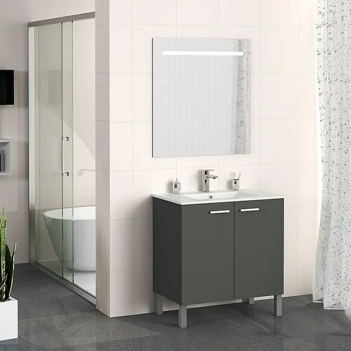 Artysan Mueble bajo de lavabo Fran - An x Pr x Al: 80 x 46 x 85 cm, Antracita - Un baño moderno con un tocador gris con lavabo y un espejo iluminado sobre el lavabo, realzando el estilo del baño.