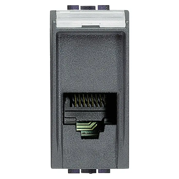 Bticino Living Light Toma de teléfono RJ11 - Antracita, Instalar - Primer plano de un conector de red RJ45 gris oscuro con contactos metálicos para una conexión estable y fiable.