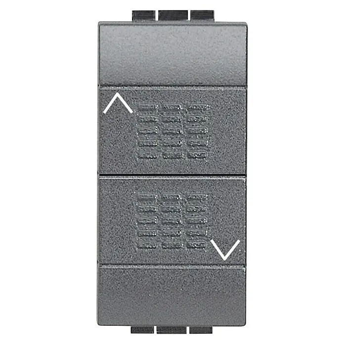 Bticino Living Light Pulsador Doble 1M - Antracita, x 1, Plástico, Instalar - Primer plano de un interruptor de persiana gris con flechas arriba y abajo para controlar la persiana de la ventana.