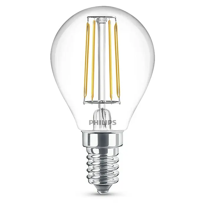 Philips Bombilla LED Classic CW Transparente - E14, No regulable, Blanco frío, 470 lm, 40 W - Primer plano de una bombilla LED pequeña y transparente con filamentos visibles y una base plateada sobre un fondo negro.